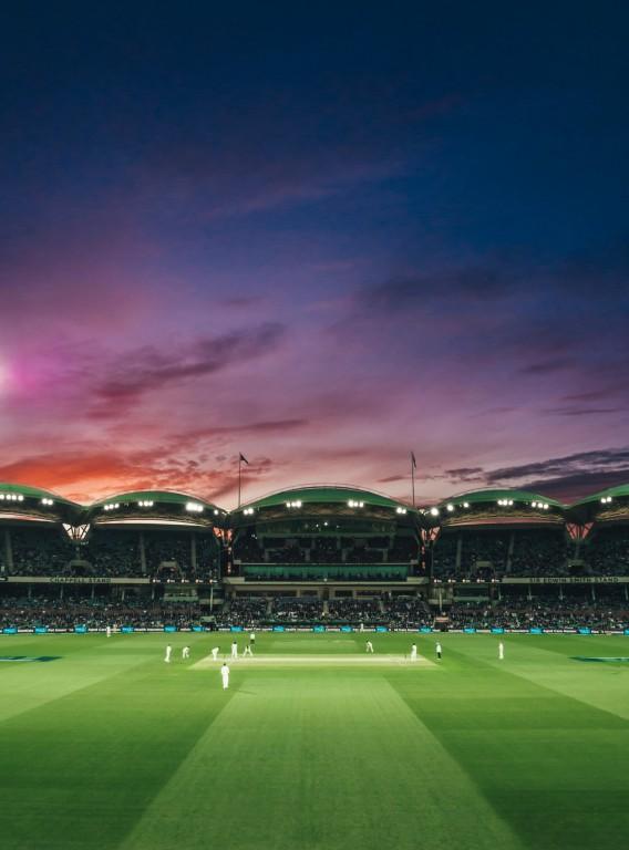 Stadium crowd watching cricket